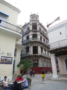 Example of old building on edge of a major old town square that will someday be fixed up and bought by a chain.