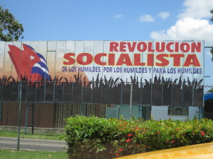 Sign reads Socialist Revolution by and for the Downtrodden